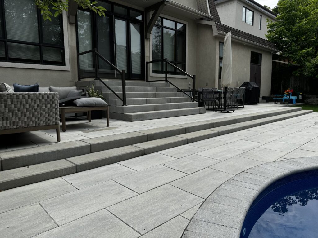 Large-format paver patio with clean lines in a Westboro backyard, built by WLS Landscaping